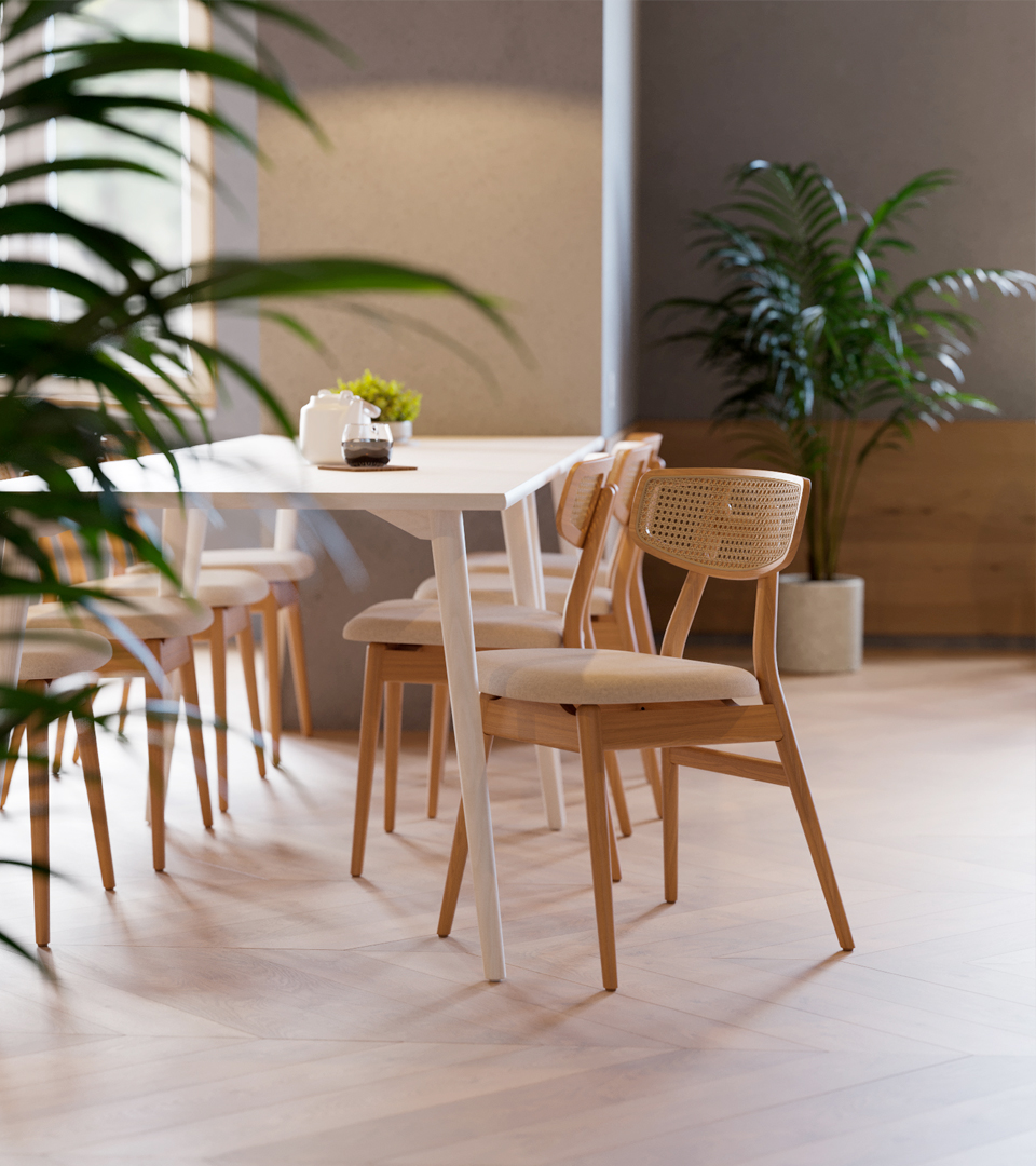 Single chair at a table with a couch in the backdrop